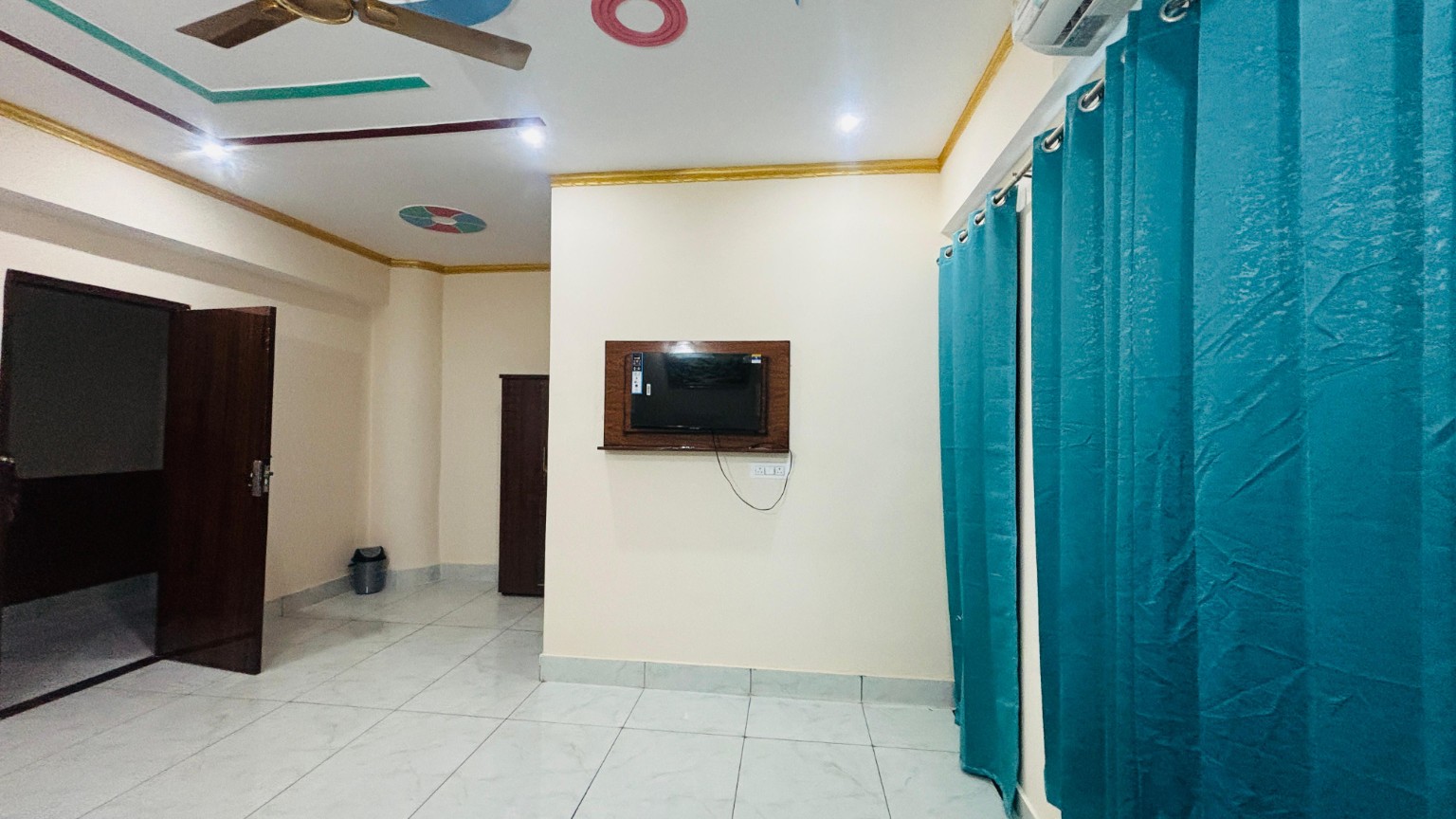 Gagan Hotel room with television